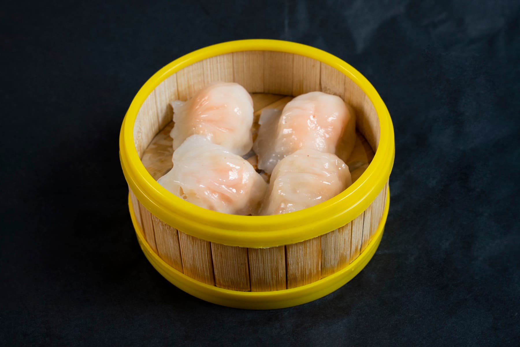 Crystal shrimp dumplings in a bamboo steamer