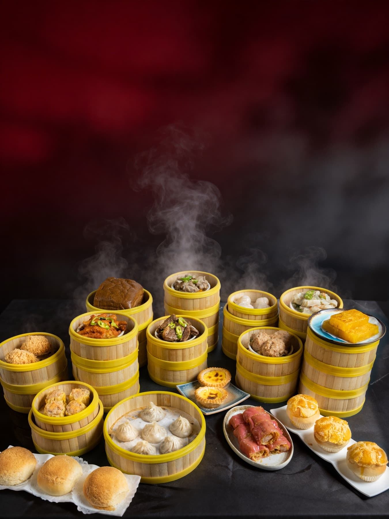 Full dim sum spread in bamboo steamers