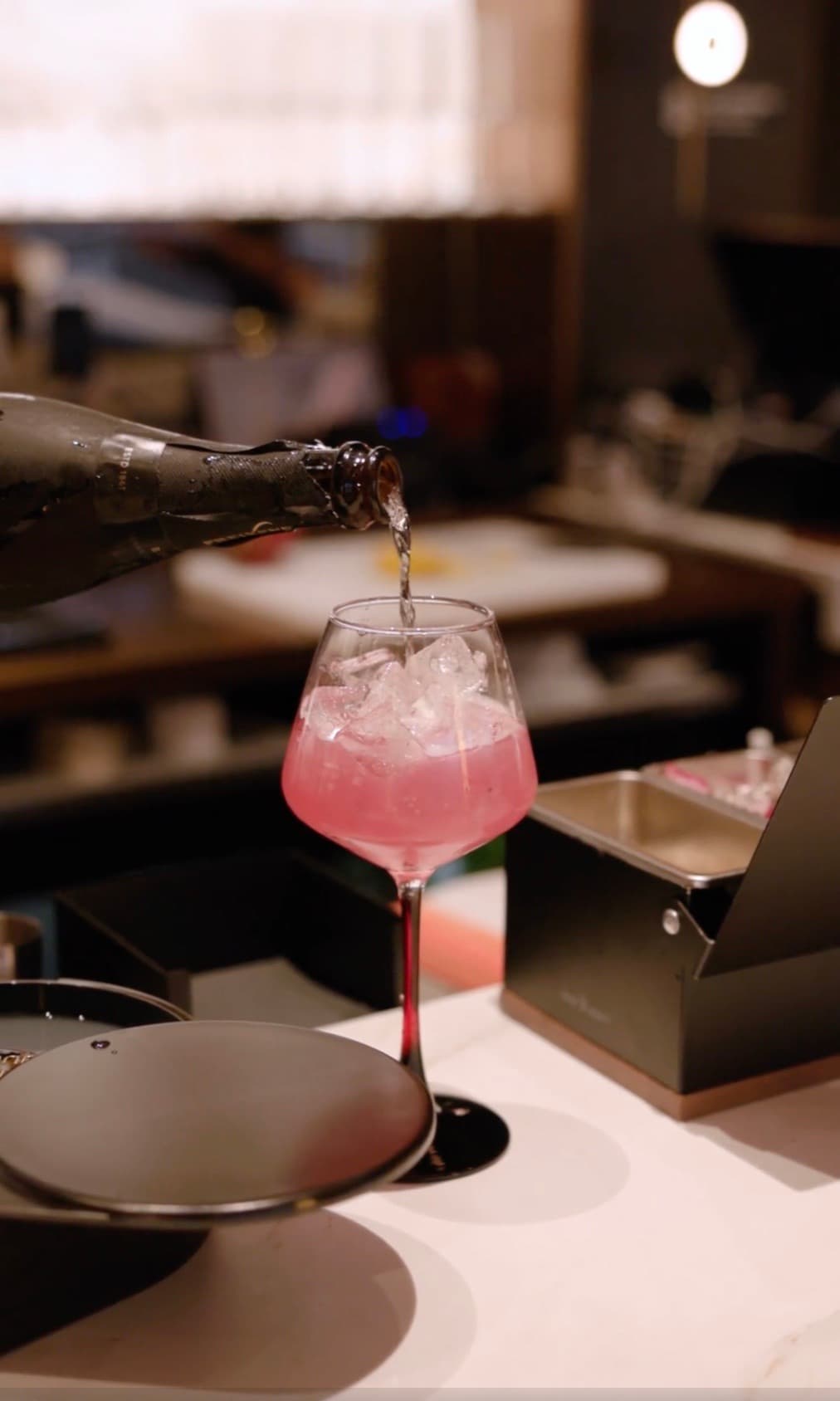 Sparkling wine poured into a pink spritz