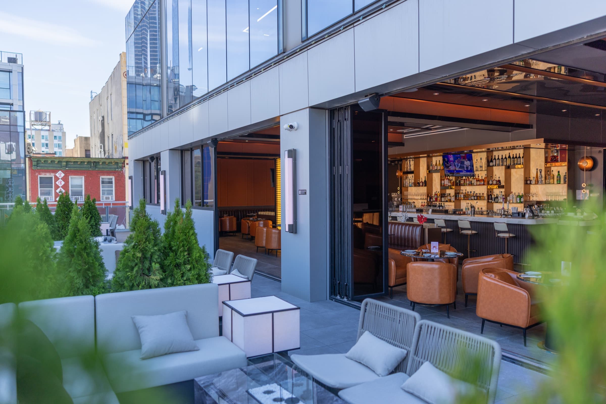 Terrace lounge seating open to the indoor bar